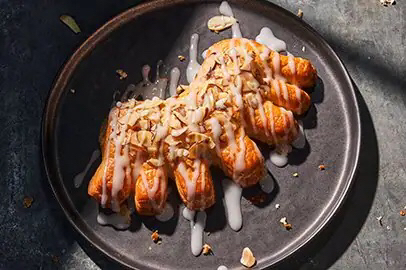 Picture of a bear claw on a plate.