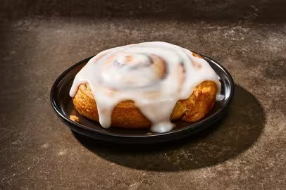 Picture of a cinnamon roll on a plate.