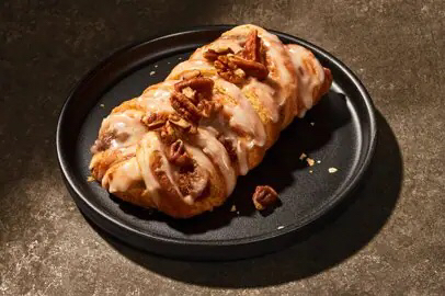 Picture of a pecan braid on a plate.